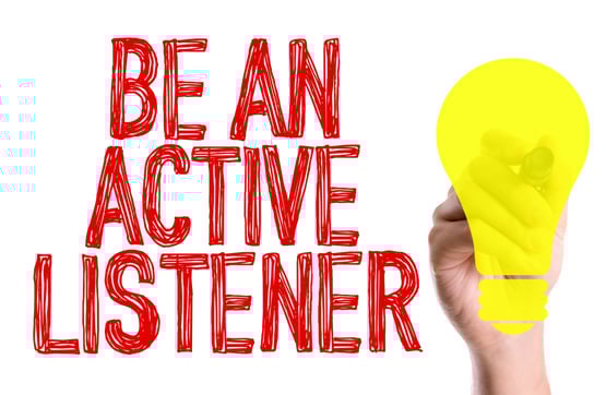 Hand with marker writing the text Be An Active Listener-1