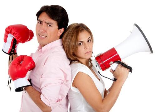 Man with boxing gloves and woman with megaphone ready for a couples fight ? isolated-1
