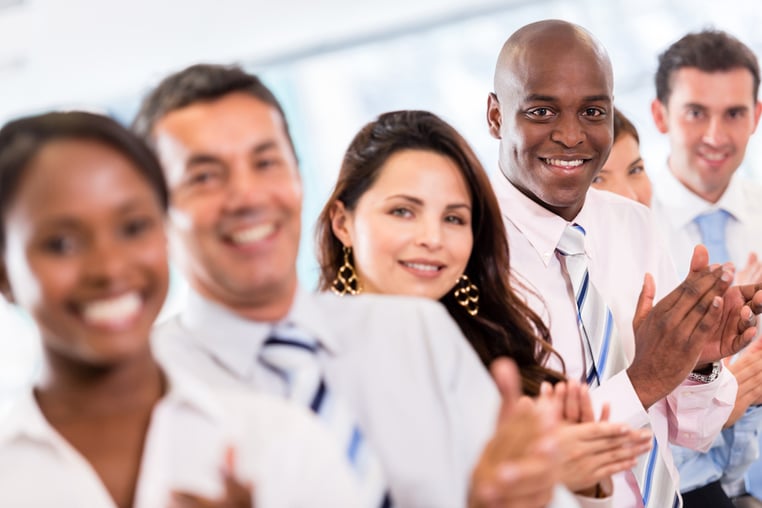 Successful business group applauding after a presentation-1